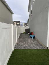 North side of yard featuring shed.