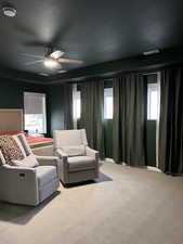 Master bedroom with windows and draperies