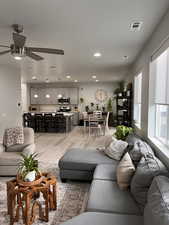 View to kitchen and dining area from great room. Extended square footage of great room makes the open floor plan even more desirable