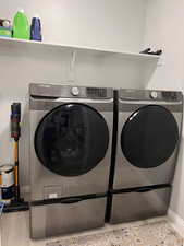Laundry area with separate washer and dryer and pedestals