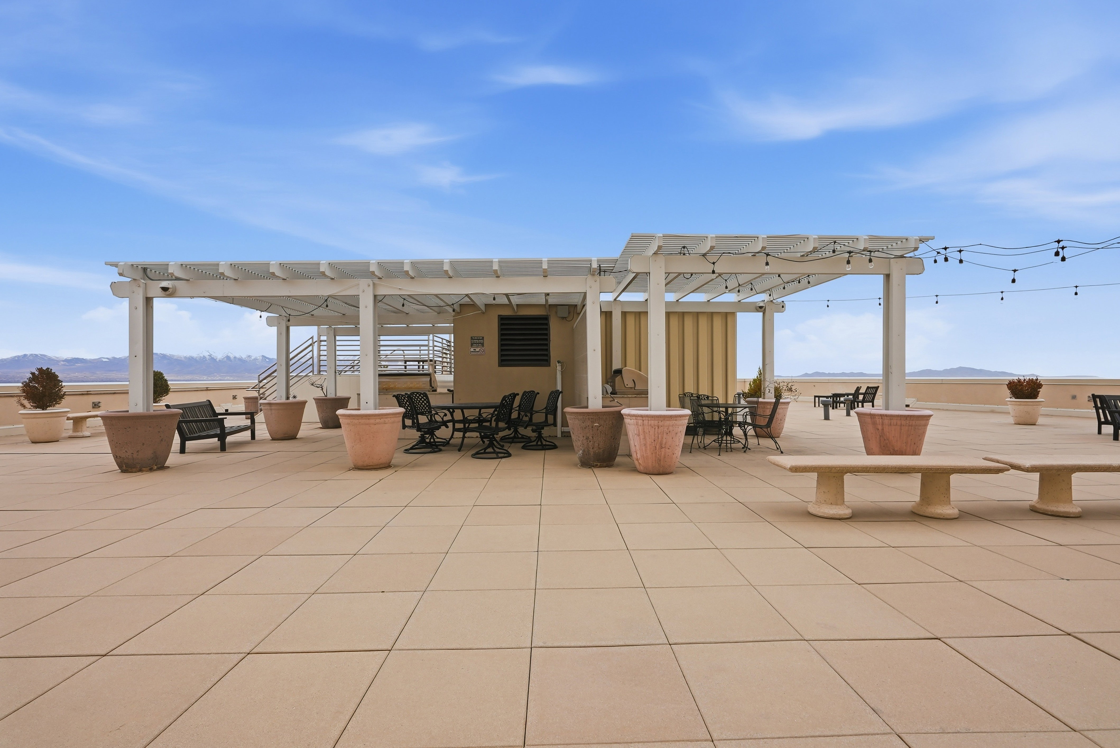 View of patio with a mountain view, a pergola, and outdoor dining area