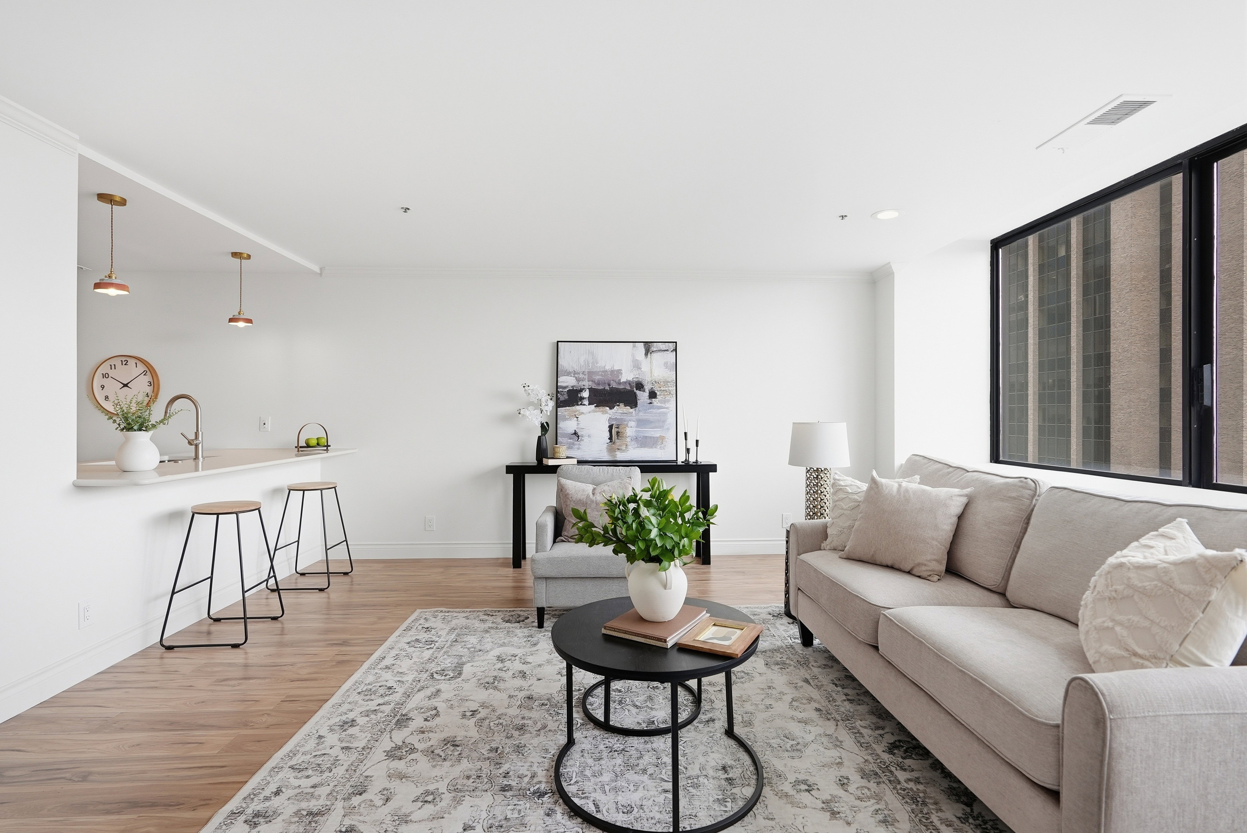 Living area featuring light wood finished floors and recessed lighting