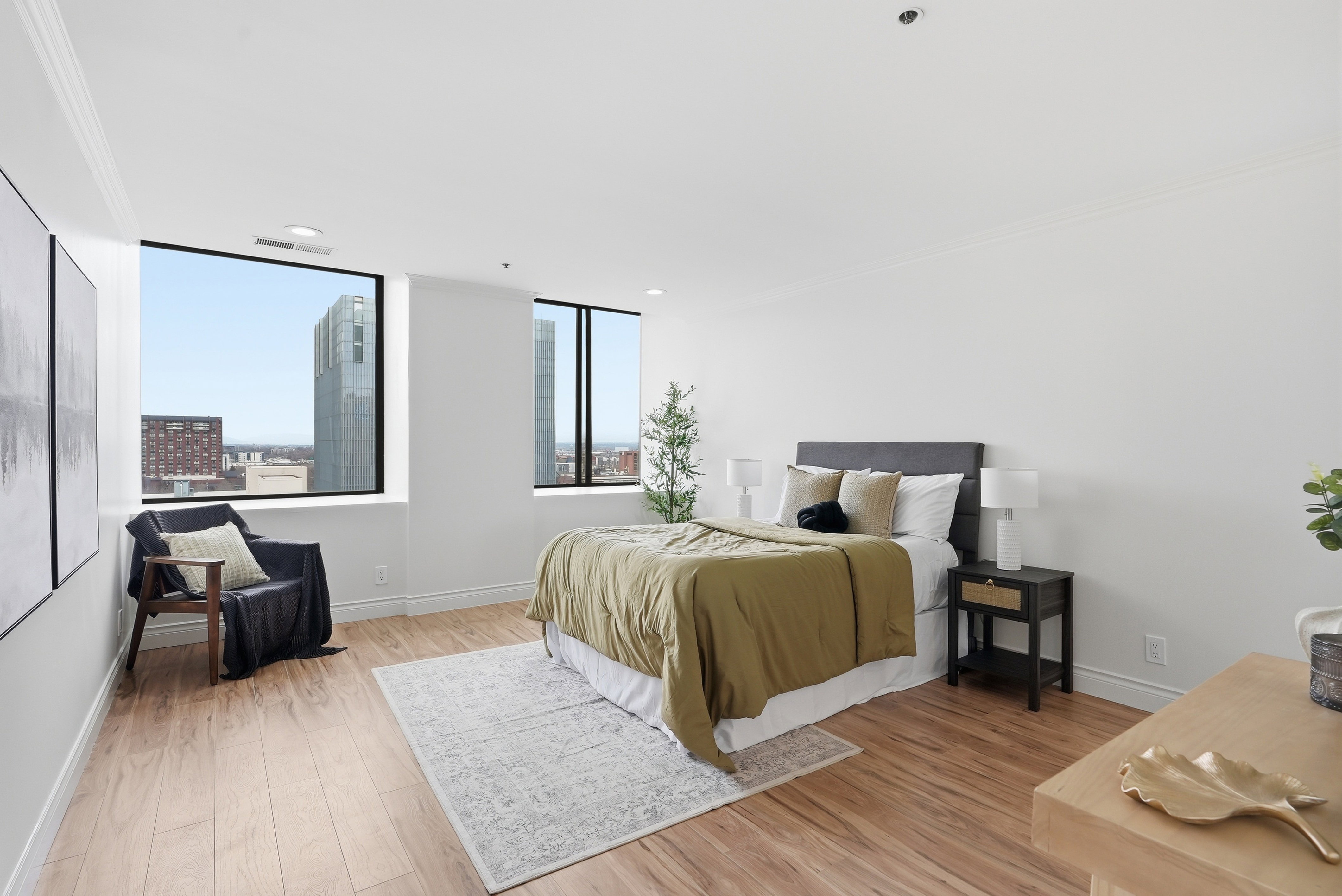 Bedroom featuring crown molding and light wood finished floors