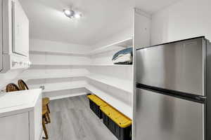 Storage area with stacked washer / drying machine