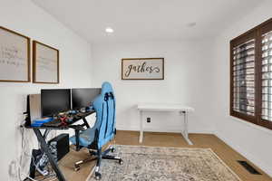 Office area featuring recessed lighting and light carpet