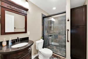 Bathroom featuring vanity and a stall shower
