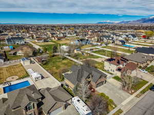 Aerial view of residential area featuring a pool area and a mountain backdrop
