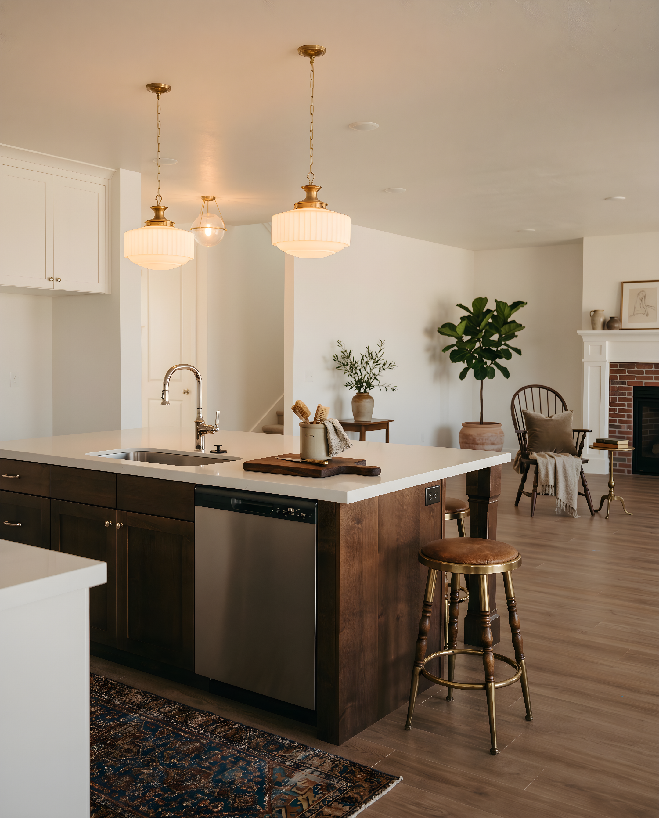 Kitchen island featuring a stainless steel sink, pull-down faucet, and integrated dishwasher