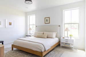 Bedroom with light colored carpet