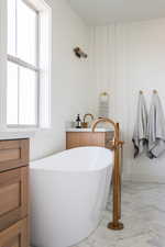 Full bath featuring a freestanding bath