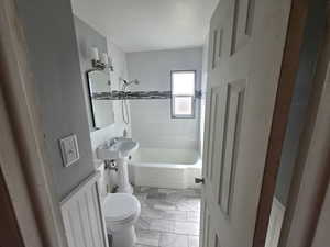 Full bath with toilet and shower / washtub combination