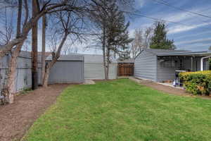 Fenced yard with an outdoor structure