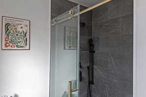 Full bath featuring a stall shower