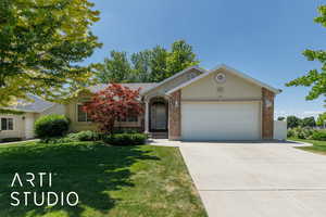 Exterior View, front of home showing landscaping and driveway. East facing side of property.