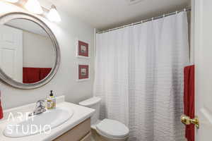 Full bath featuring vanity and a shower with shower curtain