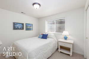 Bedroom with carpet and baseboards