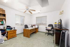 Office featuring a ceiling fan and baseboards