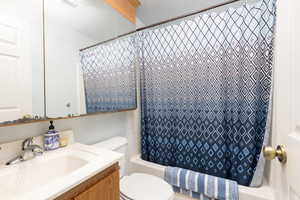 Full bathroom featuring vanity and shower / tub combo with curtain