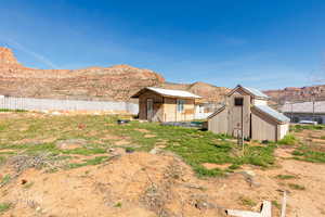 View of yard with a mountain view, an outbuilding, and a barn