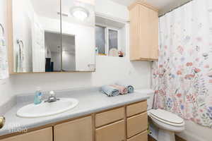 Bathroom featuring toilet and vanity