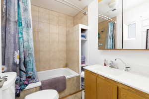Bathroom with vanity and shower / bath combo