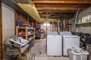 Below grade area featuring separate washer and dryer