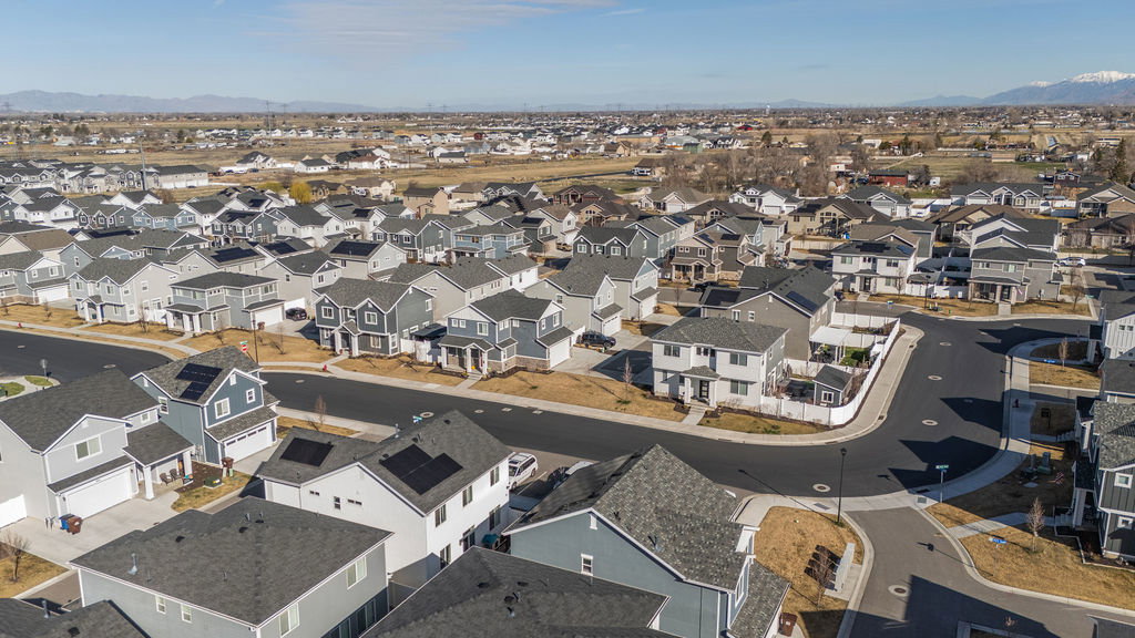 Aerial view of residential area featuring a mountain backdrop