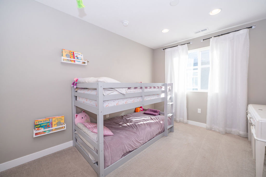 Bedroom featuring light colored carpet and recessed lighting