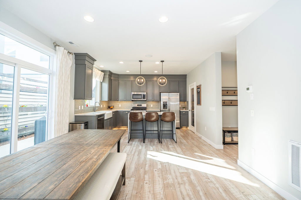 Dining room with recessed lighting and light wood-type flooring