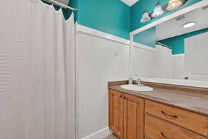 2nd floor Bathroom with vanity and curtained shower