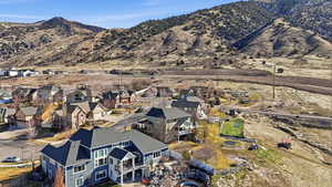 Aerial perspective of suburban area with a mountain backdrop