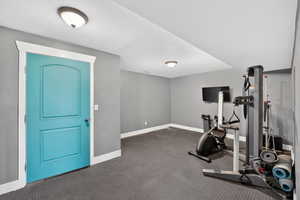 Exercise area featuring baseboards