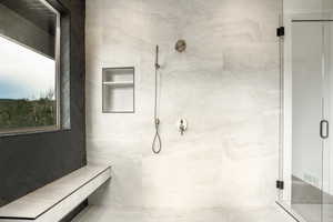 Bathroom with a marble finish shower
