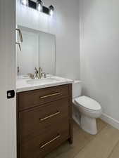 Bathroom with vanity and light wood-type flooring