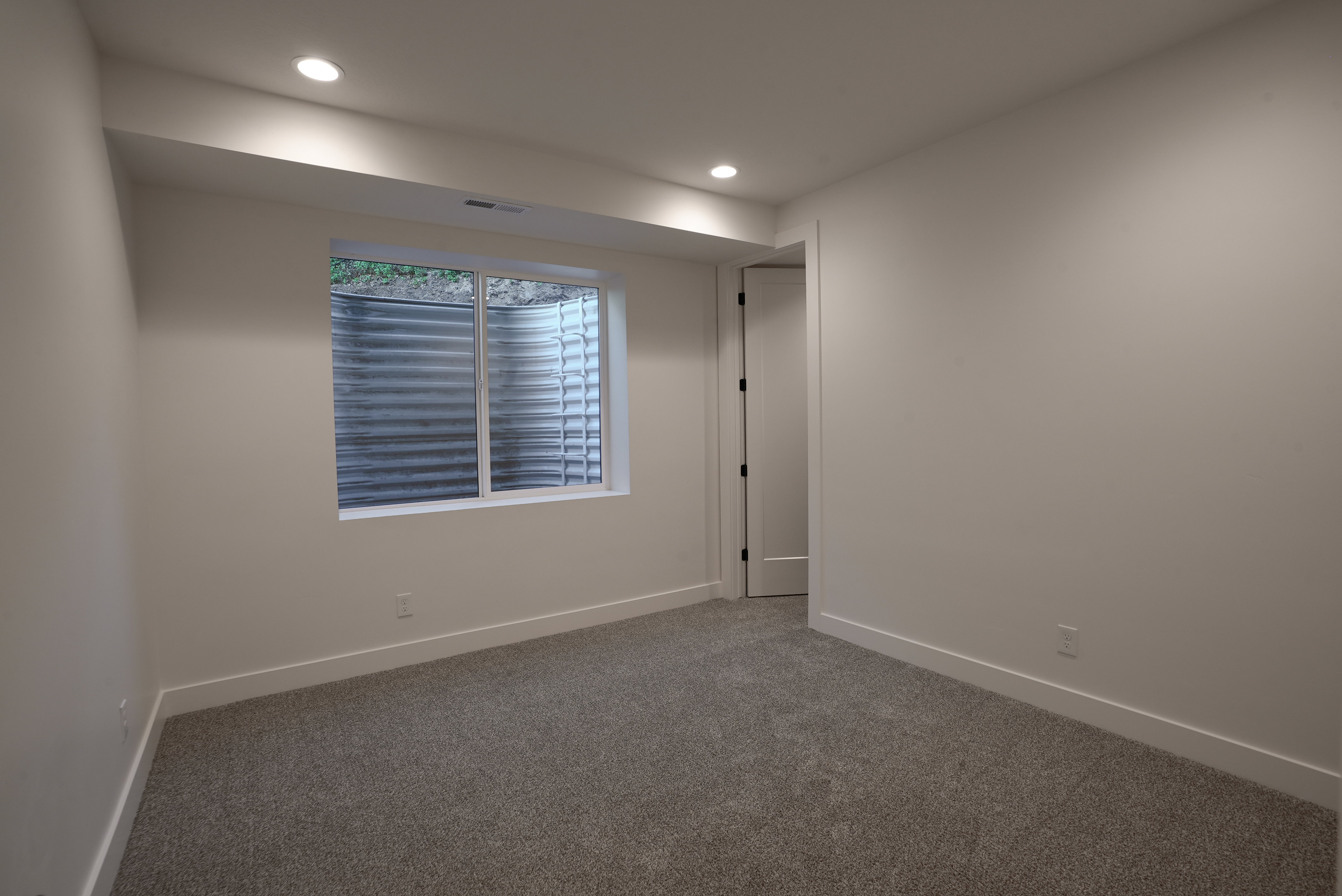 Unfurnished room featuring carpet and recessed lighting