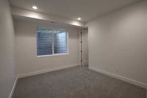 Unfurnished room featuring carpet and recessed lighting
