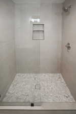 Full bathroom featuring a stall shower