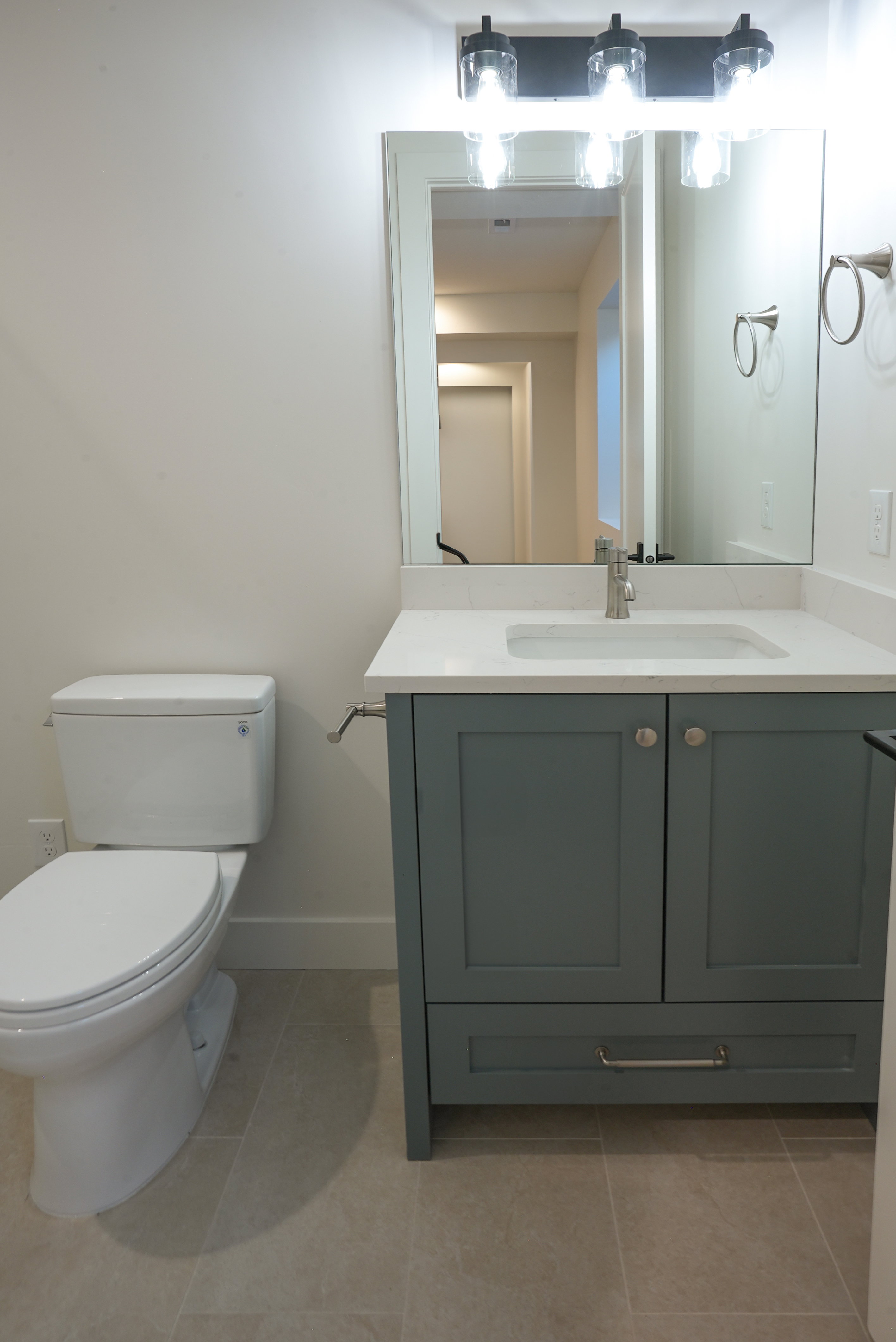 Bathroom with vanity and light tile patterned floors