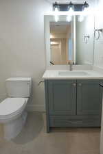 Bathroom with vanity and light tile patterned floors