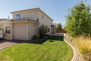 Rear view of property featuring stucco siding