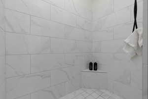 Bathroom with tiled shower