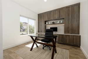 Office space with light wood-type flooring