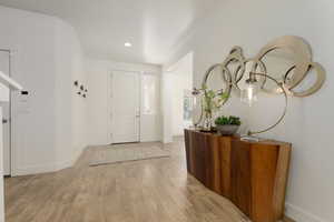 Entrance foyer featuring light wood-type flooring and recessed lighting