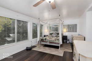 Bedroom featuring dark wood-style floors and a ceiling fan