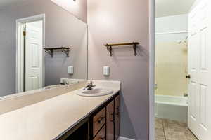 Bathroom featuring vanity and bathtub / shower combination