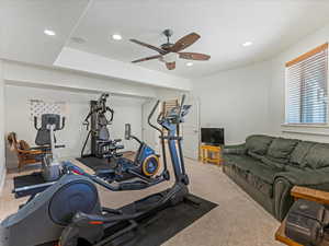 Workout room featuring ceiling fan, recessed lighting, and carpet