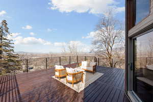 Wooden terrace featuring an outdoor living space