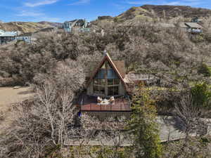 Rear view of property with a deck with mountain view