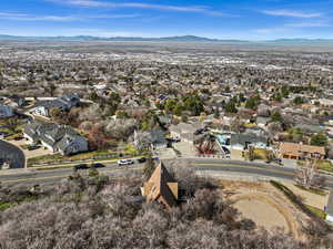 Aerial perspective of suburban area featuring a mountain backdrop