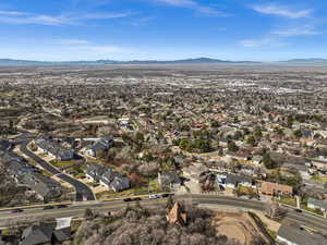 Aerial view of residential area with a mountainous background